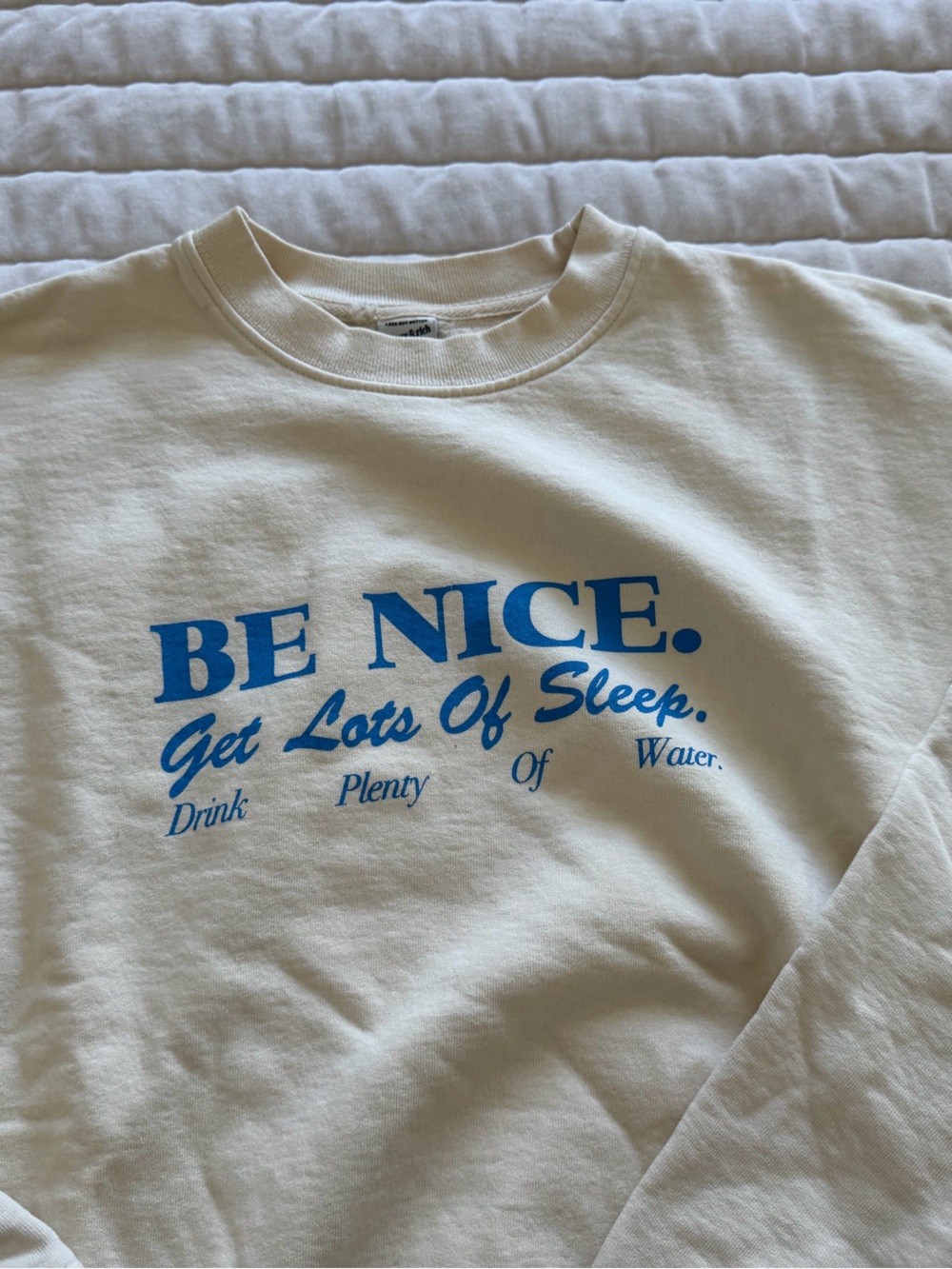 Sporty & Rich Cream Crewneck Sweatshirt with Blue "BE NICE" Graphic